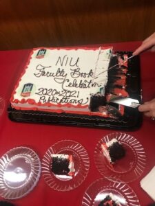cake with "NIU Faculty Book Celebration 2020 & 2021 Publications" written on it